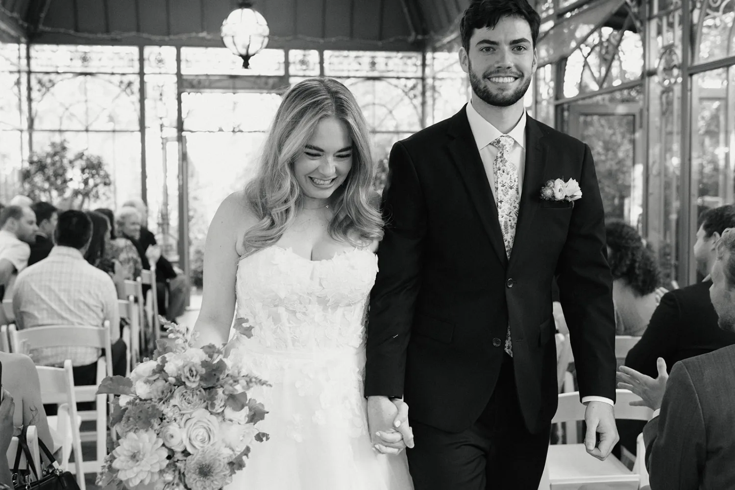 Bride and groom exit their ceremony at the Denver Botanic Gardens