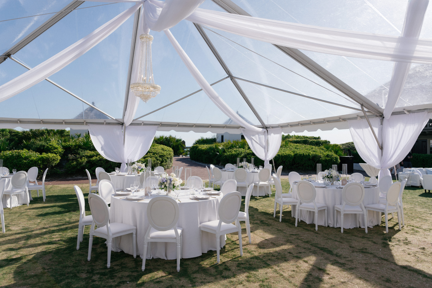 A tented wedding reception on the Western Green at Rosemary Beach